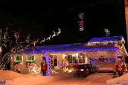 a house at night decorated in christmas lights