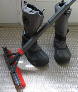 snow boots and a snow scraper 