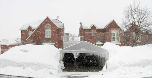 snow canopy also known as a tempo keeps driveway free of snow