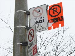 no parking sign on snowy montreal street