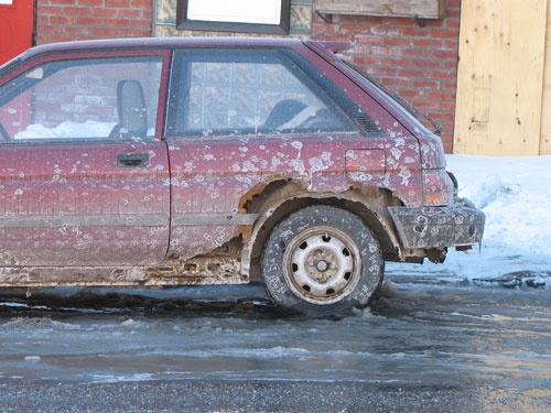 a rusted car due to all the salt used during winter